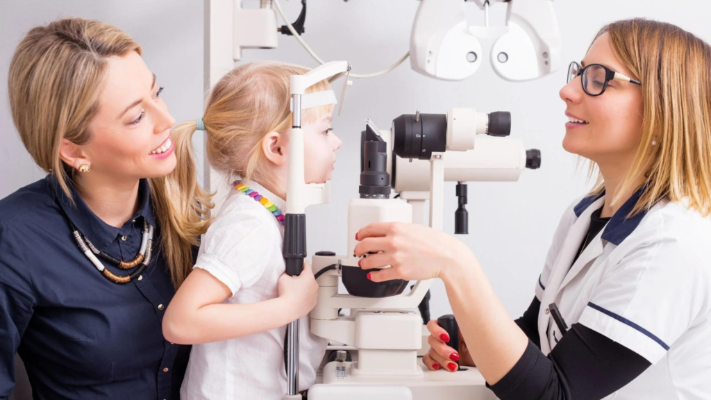 Optometrist explaining a child's vision assessment and follow-up options to a parent